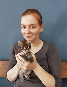 Vet Student Olga holding a very cute tabby kitten